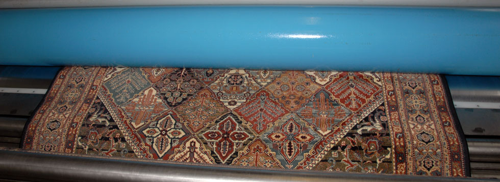 Carpets are drained in large centrifugal machines
